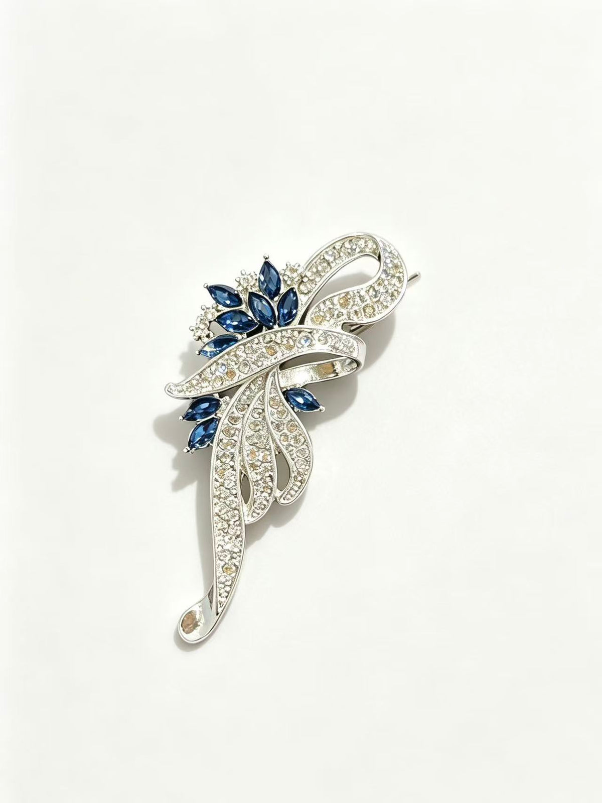 Crystal floral brooch pin detail view on white background