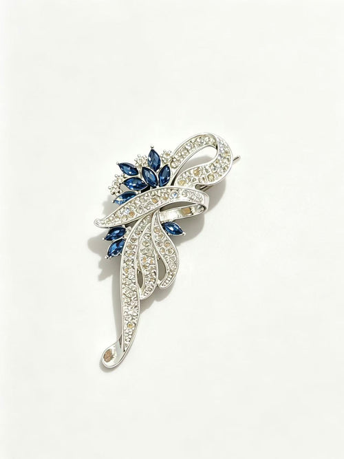 Crystal floral brooch pin detail view on white background