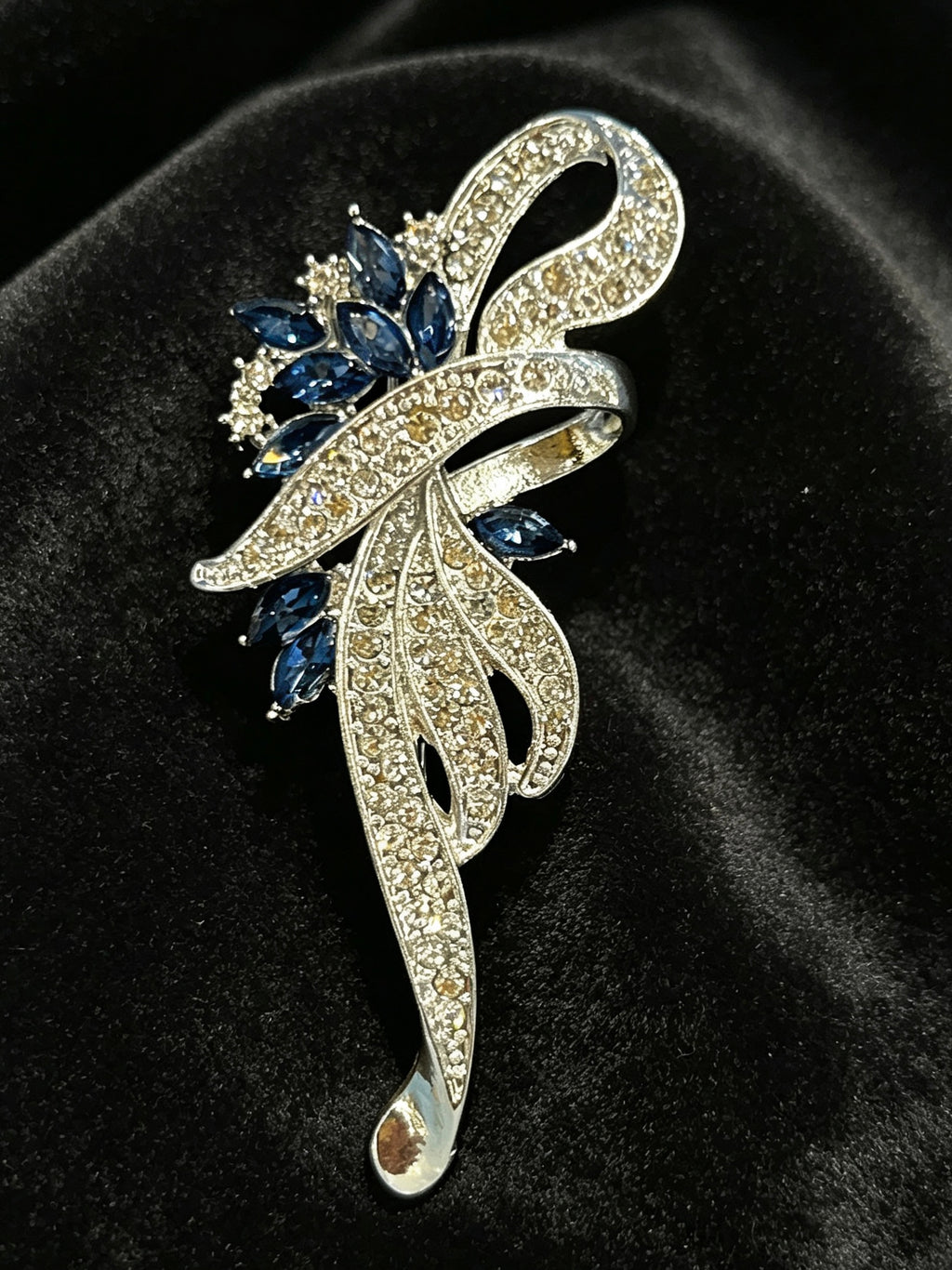 Crystal floral brooch pin close-up on black velvet