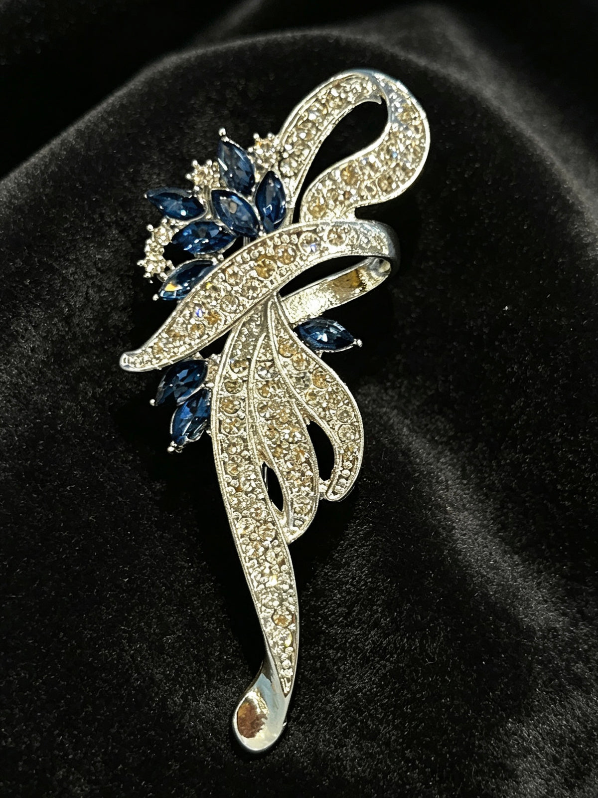 Crystal floral brooch pin close-up on black velvet