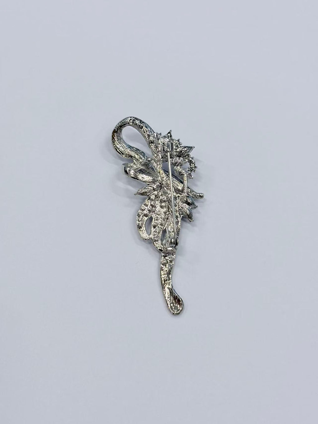 Crystal floral brooch pin side angle on white background