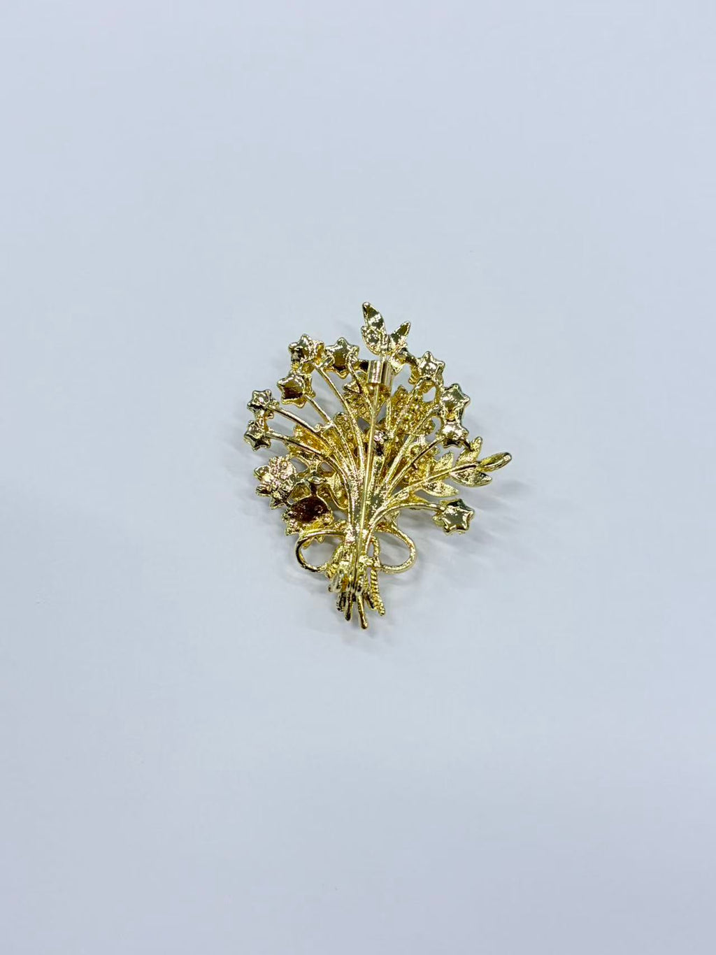 Crystal flower bouquet brooch pin angled view on white background