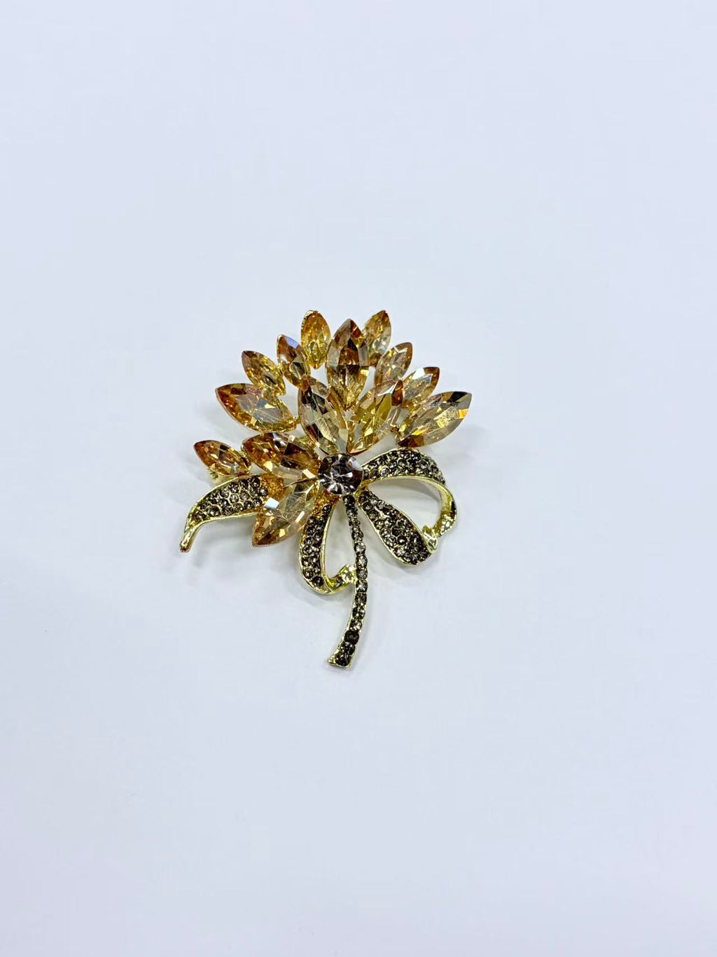 Crystal flower bow brooch pin isolated view on white background