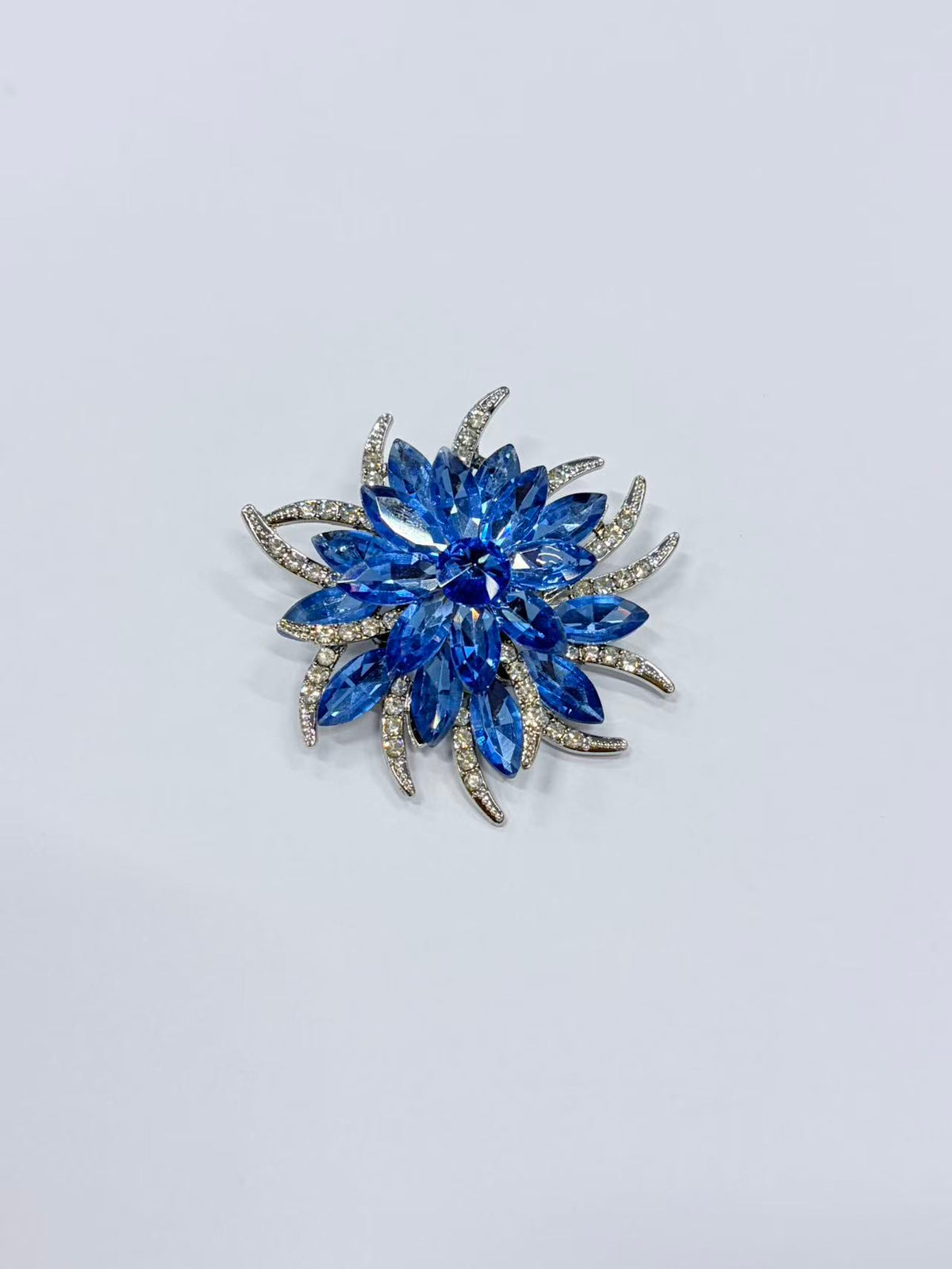 Crystal flower brooch pin front view on white background