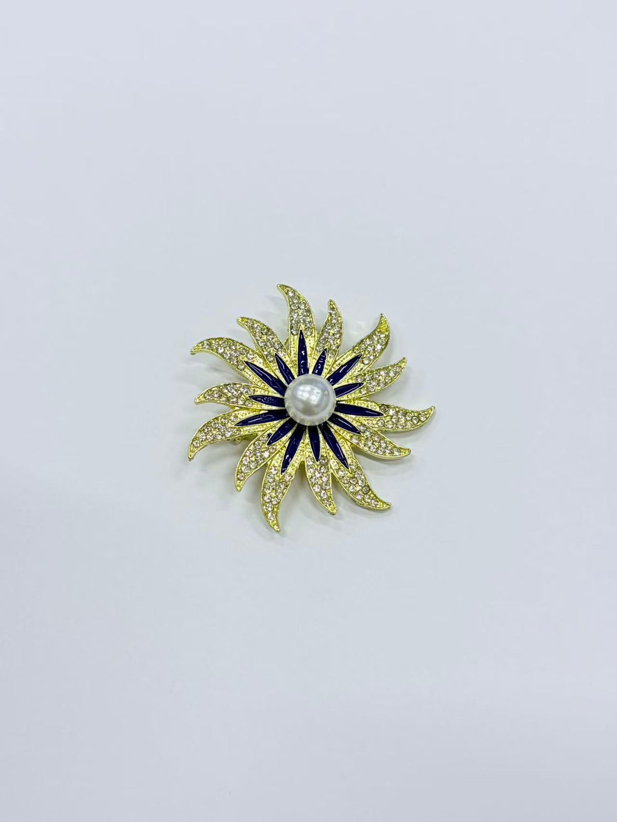 Crystal sunburst brooch pin isolated view on white background