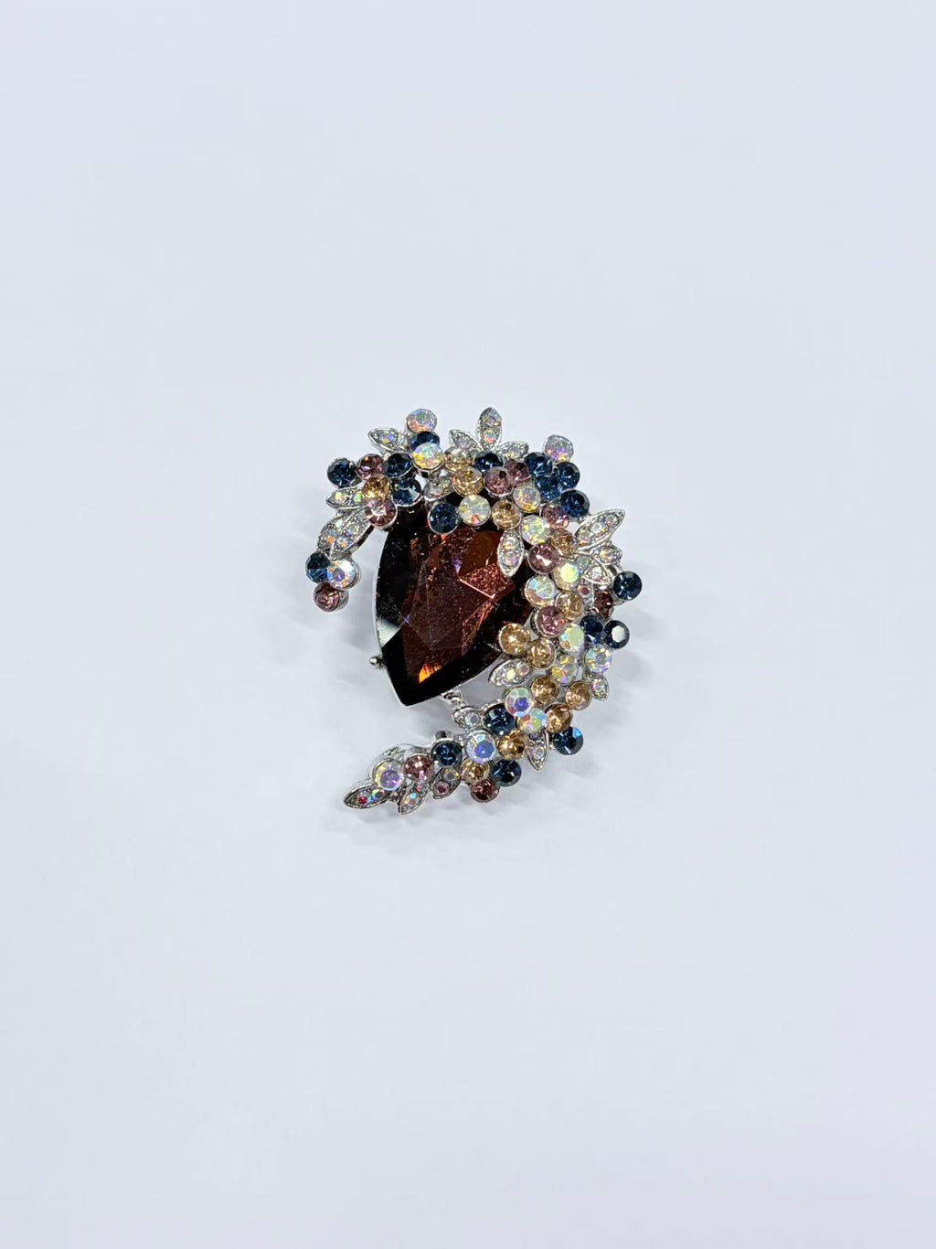 Crystal teardrop floral brooch pin detail view on white background