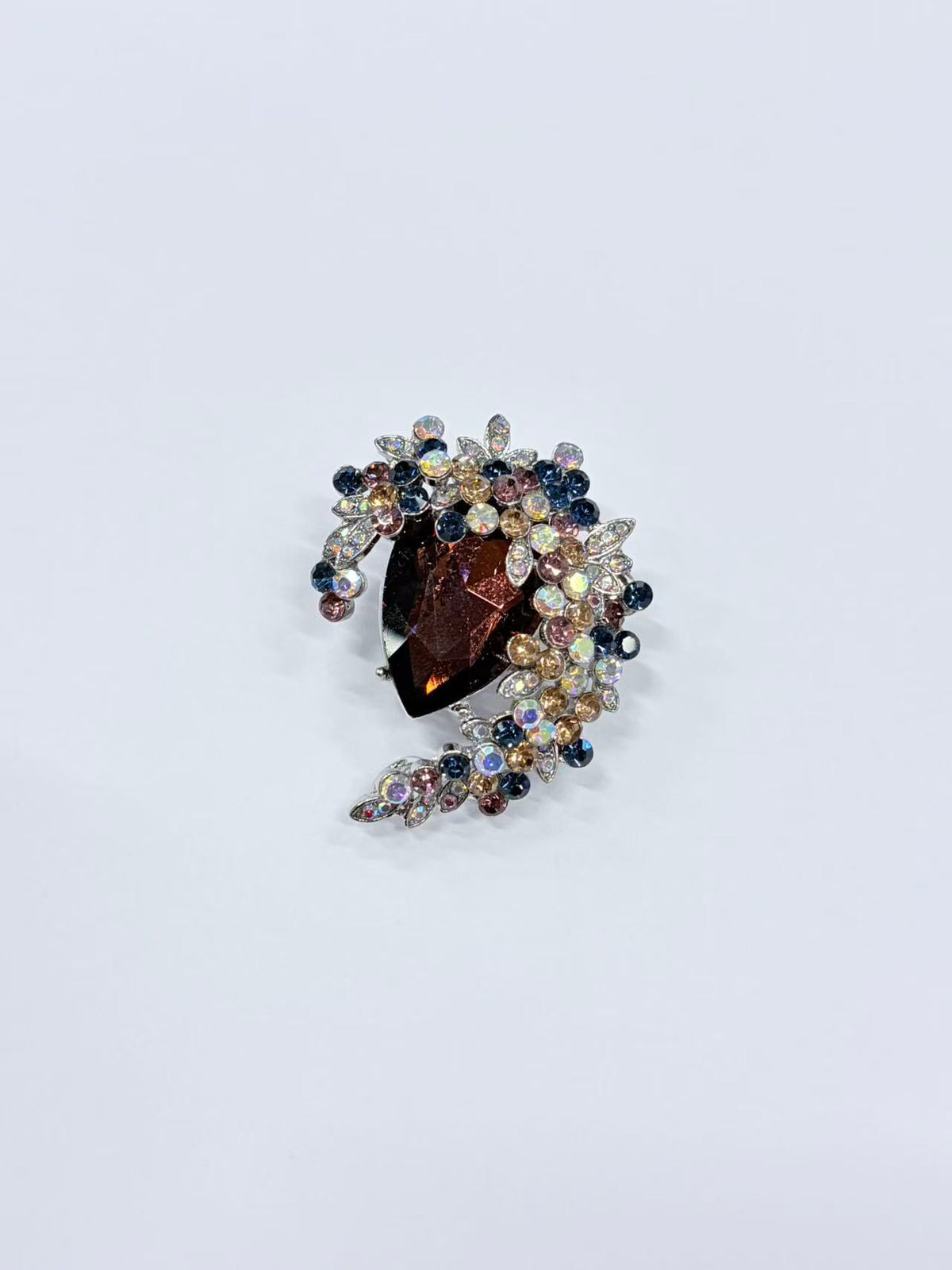 Crystal teardrop floral brooch pin detail view on white background
